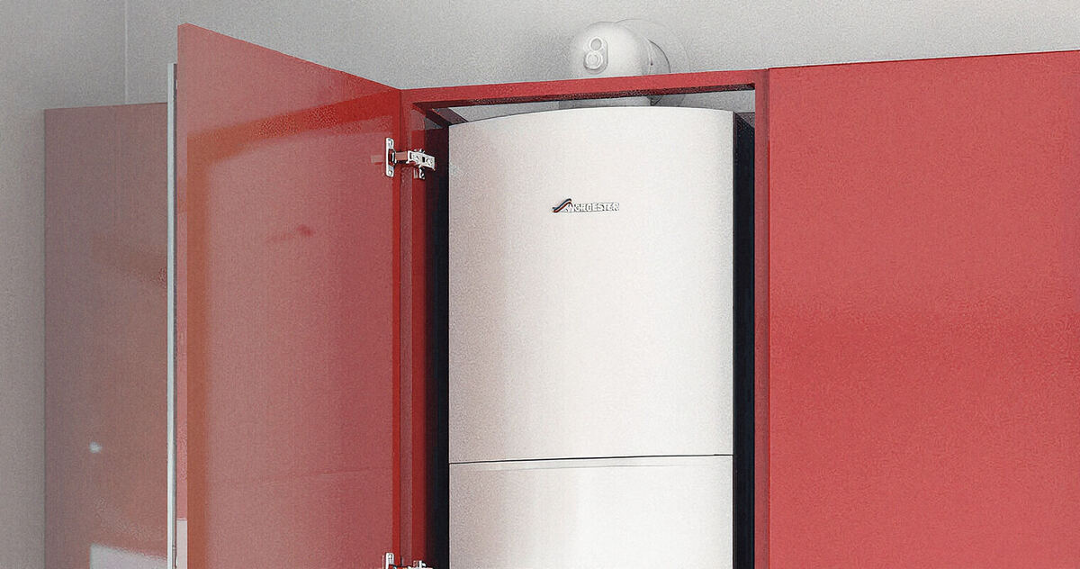A Worcester boiler fitted inside a red kitchen cupboard